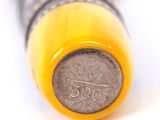 a close up of a yellow pen with a black tip