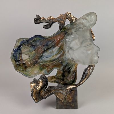 statue of a woman with a hat on her head on a base