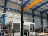an image of a warehouse with a fork lift in the middle of the room
