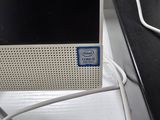 an image of a desktop computer with a blue sticker on it