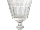 clear glass goblet sitting on top of a glass plate