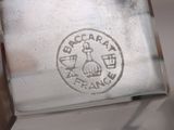 a close up of a silver plate with a logo on it