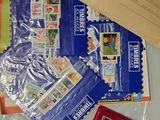 a bag of stamps and stamps on a table