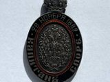 an image of a silver medal on a white surface