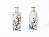 pair of chinese vases with flowers and birds painted on them