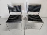 two chairs that are sitting next to each other