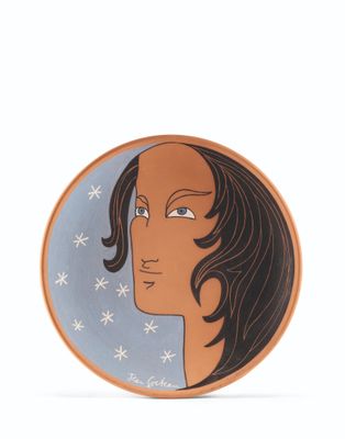 an image of a plate with a woman ' s face painted on it