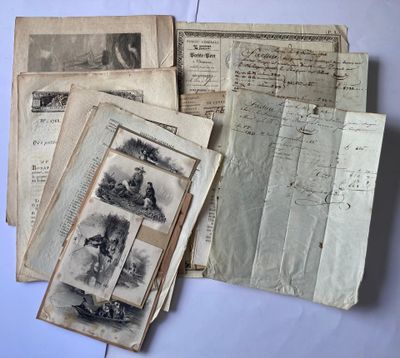 several old papers are stacked on top of each other on a table