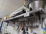 a large metal bucket on a shelf in a kitchen