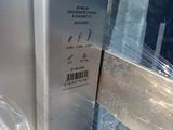 a close up of a metal door with plastic wrapped around it