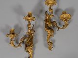 pair of antique brass wall sconces in the style of person