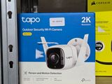 two cameras sitting on a shelf in a store
