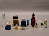 many different types of perfume bottles lined up on a table