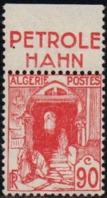 a red and black stamp with a picture of a man in a doorway