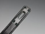 an image of a close up of a black leather belt with a metal buckle