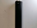 an air purifier sitting on top of a counter next to a wall