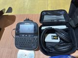 a cell phone and headphones in a case on a table