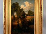 une peinture à l'huile représentant un paysage avec des arbres et des nuages, dans un cadre doré