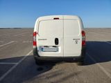 a white van that is parked in a parking lot