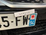 a sticker on the front of a car that has a star on it