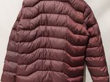a close up of a jacket hanging on a hanger