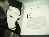 an open book with a picture of a woman wearing a hat