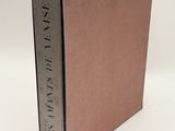 the book is open on a white surface with a white background