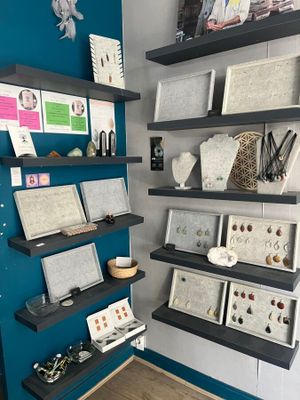 a display of jewelry on the wall in the room