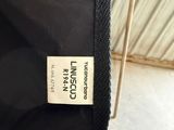 a close up of the label on the back of a black jacket