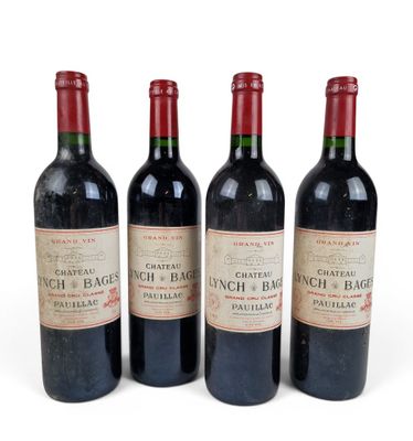 three bottles of red wine sit next to each other on a white surface