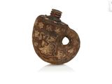 an old wooden bottle with a lid and a metal cap