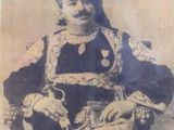 an old photo of a man dressed in a costume