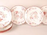 several plates are lined up on top of each other on a table