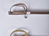 three different types of swords are displayed on a white surface