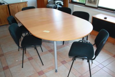 a table and chairs in a room with tile flooring