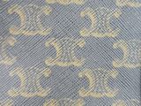 a close up of a blue and yellow fabric with a pattern on it