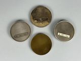 three different types of metal buttons are shown on a white surface