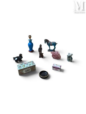 a lot of miniature figurines that are on a white surface