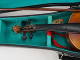 a violin in a case with a bow in it