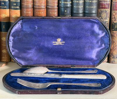 a purple case with silverware in it on a table