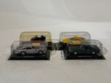 two toy cars that are sitting in a case
