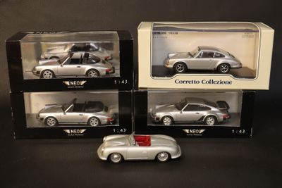 three boxed silver cars are sitting on display in a box
