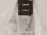 a picture of a piece of luggage that is wrapped in plastic