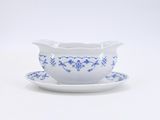 an image of a blue and white bowl and saucer on a saucer