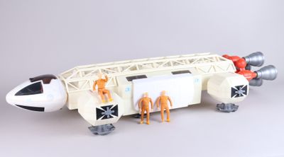 a model of a space shuttle with people inside of it