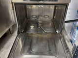 a stainless steel oven with a door open in the kitchen