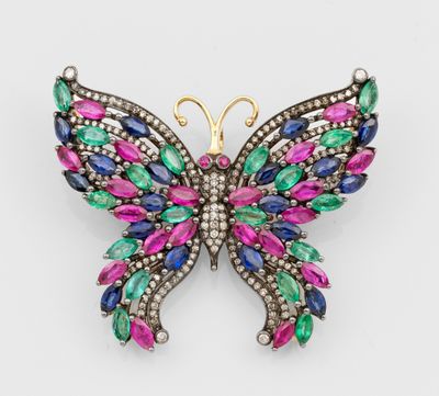 une broche en forme de papillon ornée de pierres multicolores et de diamants