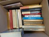 a box full of books sitting on top of a table