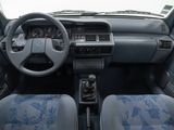 dashboard of a car with blue seats and a steering wheel