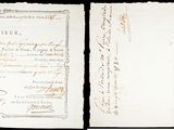 un vieux document écrit posé sur une table